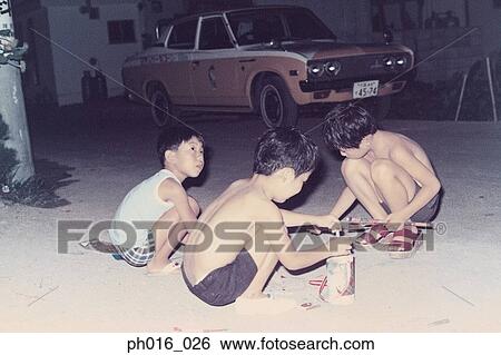 Three boys playing in a garage View Large Photo Image Stock Photograph - Three boys playing in a garage. Fotosearch