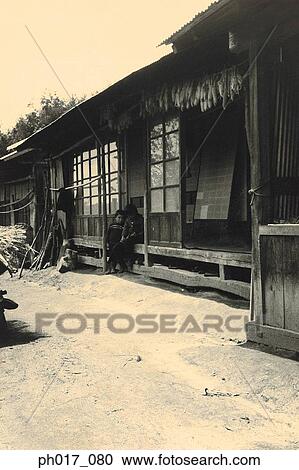 Stock Image - Children in wooden house. Fotosearch