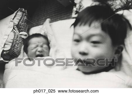 Elder brother and a baby View Large Photo Image Stock Photography - Elder brother and a baby. Fotosearch