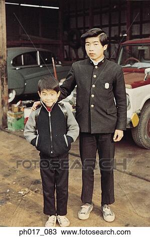 Elder brother and younger brother at garage View Large Photo Image Stock Image - Elder brother and younger brother at garage. Fotosearch