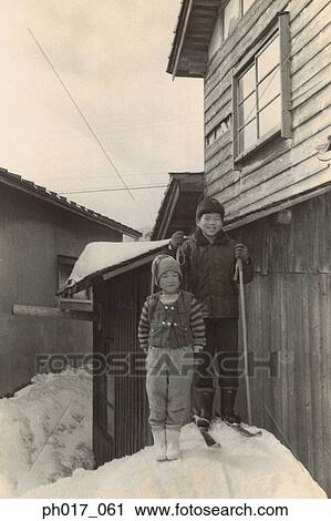 Stock Image - Elder brother and younger sister. Fotosearch