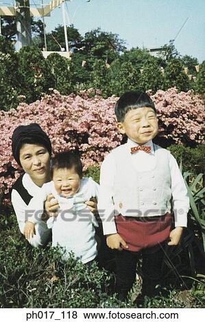 Mother and children at a park View Large Photo Image Stock Photo - Mother and children at a park. Fotosearch