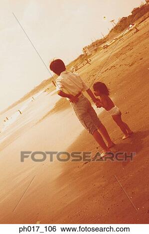 Mother and daughter at the beach View Large Photo Image Stock Photograph - Mother and daughter at the beach. Fotosearch