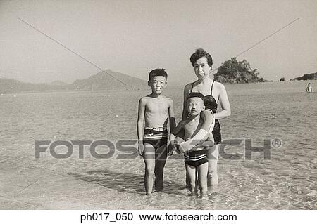 Mother and sons at seaside View Large Photo Image Stock Image - Mother and sons at seaside. Fotosearch