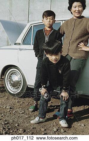 Stock Image - Mother and two sons. Fotosearch