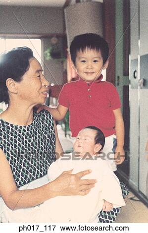 Mother, son and an infant View Large Photo Image Stock Photo - Mother, son and an infant. Fotosearch