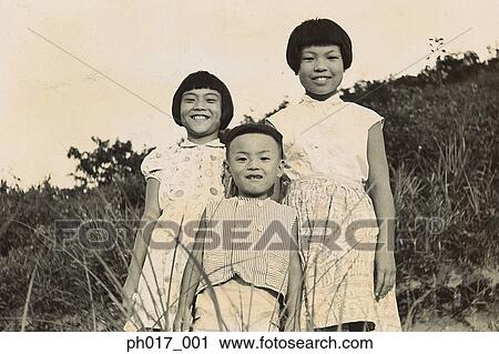 Stock Image - Portrait of brother and sisters. Fotosearch