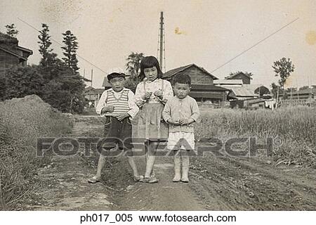 Stock Photography - Portrait of brother and sisters. Fotosearch