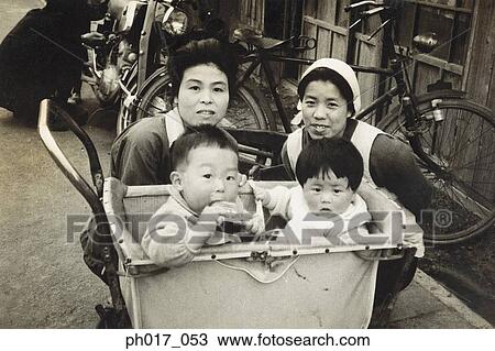 Stock Image - Sisters and their children. Fotosearch