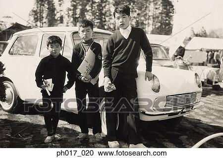 Stock Image - Three brothers in school uniform. Fotosearch