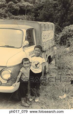 Two brothers and a truck View Large Photo Image Stock Photo - Two brothers and a truck. Fotosearch