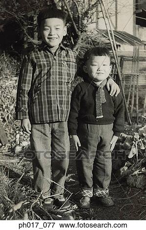 Two brothers at backyard View Large Photo Image Stock Photo - Two brothers at backyard. Fotosearch
