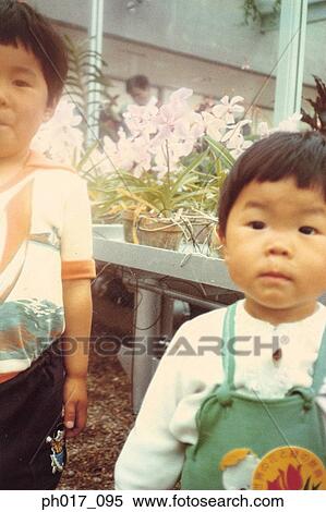 Two brothers at backyard View Large Photo Image Stock Photography - Two brothers at backyard. Fotosearch