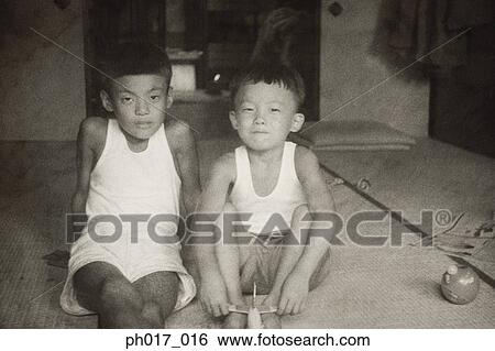 Two brothers at home View Large Photo Image Stock Photograph - Two brothers at home. Fotosearch