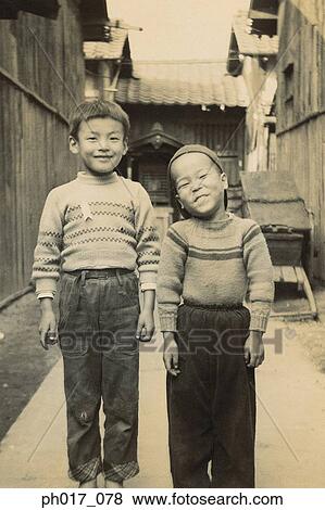Two brothers in an alley View Large Photo Image Stock Photo - Two brothers in an alley. Fotosearch
