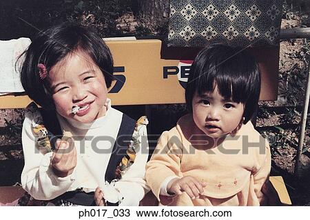 Two sisters at home View Large Photo Image Stock Image - Two sisters at home. Fotosearch