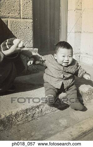 Stock Photo - Baby boy in winter wear. Fotosearch