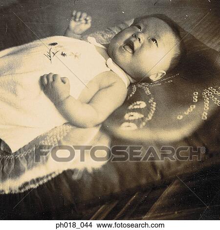 Baby boy lying on the mattress View Large Photo Image Picture - Baby boy lying on the mattress. Fotosearch