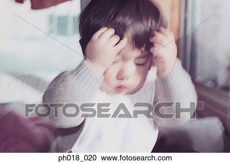 Baby boy scratching his head View Large Photo Image Stock Image - Baby boy scratching his head. Fotosearch
