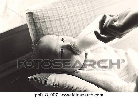 Baby drinking milk View Large Photo Image Stock Photo - Baby drinking milk. Fotosearch