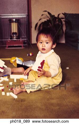 Baby girl playing with toys View Large Photo Image Stock Photo - Baby girl playing with toys. Fotosearch