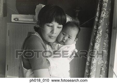 Mother hugging baby View Large Photo Image Stock Image - Mother hugging baby. Fotosearch