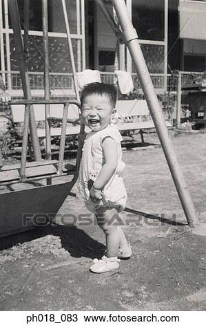 Portrait of a baby boy in the back yard View Large Photo Image Stock Image - Portrait of a baby boy in the back yard. Fotosearch