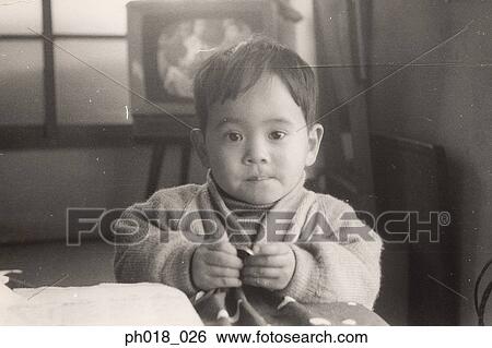 Portrait of a baby boy in the living room View Large Photo Image Stock Photograph - Portrait of a baby boy in the living room. Fotosearch