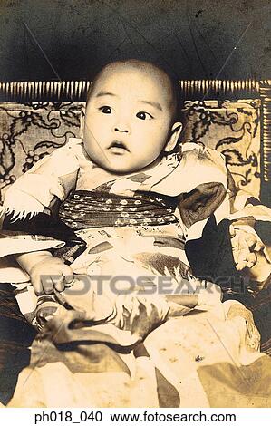 Stock Image - Portrait of a baby boy in traditional Japanese costume. Fotosearch
