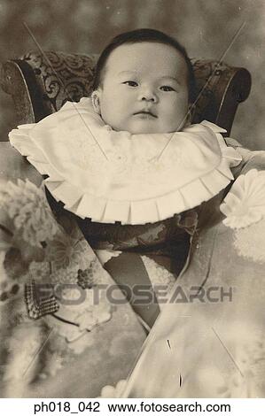 Stock Image - Portrait of a baby boy in traditional Japanese costume. Fotosearch