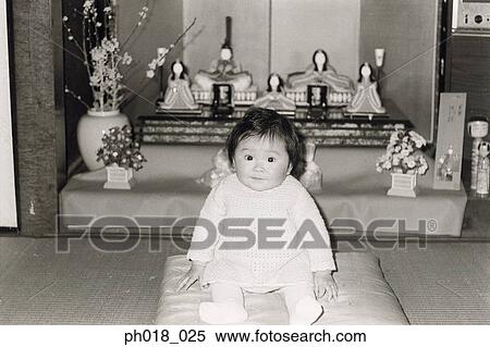 Portrait of a baby girl sitting in front of alters View Large Photo Image Stock Photography - Portrait of a baby girl sitting in front of alters. Fotosearch