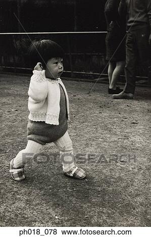 Portrait of a baby girl walking View Large Photo Image Stock Photo - Portrait of a baby girl walking. Fotosearch