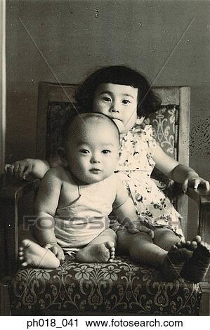 Stock Image - Portrait of brother and sister. Fotosearch