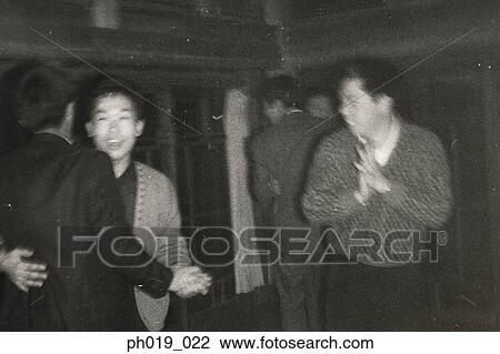 A group of men in a room View Large Photo Image Stock Image - A group of men in a room. Fotosearch