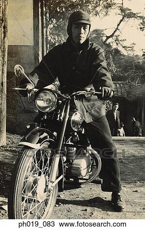 Stock Image - Asian man in motorcycle. Fotosearch