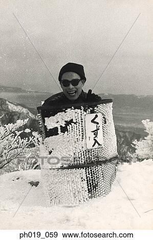Asian man in winter snow View Large Photo Image Stock Photo - Asian man in winter snow. Fotosearch