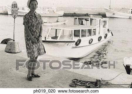 Asian woman standing at the pier View Large Photo Image Stock Image - Asian woman standing at the pier. Fotosearch