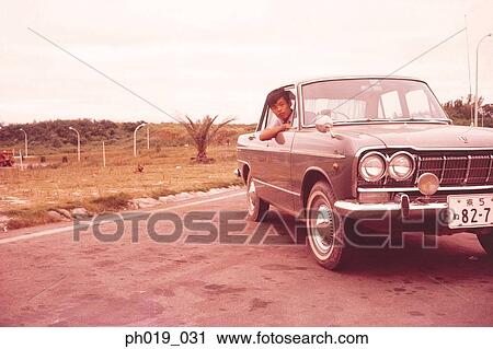 Man in a car View Large Photo Image Stock Image - Man in a car. Fotosearch