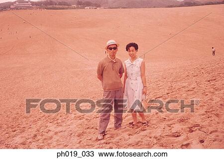 Portrait of a couple on sandy ground View Large Photo Image Stock Image - Portrait of a couple on sandy ground. Fotosearch