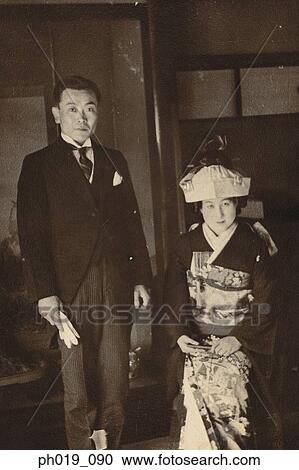 Portrait of a Japanese couple in traditional Japanese costume View Large Photo Image Stock Image - Portrait of a Japanese couple in traditional Japanese costume. Fotosearch