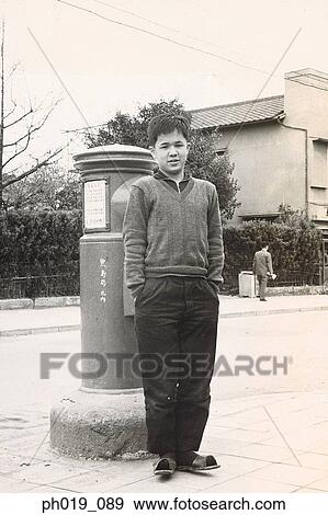 Stock Photo - Portrait of a young Asian man. Fotosearch
