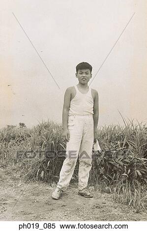 Portrait of a young Asian man View Large Photo Image Stock Photography - Portrait of a young Asian man. Fotosearch