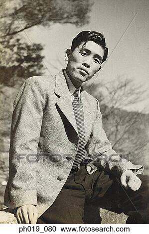 Portrait of an Asian man in business attire View Large Photo Image Stock Image - Portrait of an Asian man in business attire. Fotosearch