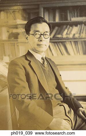 Stock Photo - Portrait of an Asian man in business attire. Fotosearch