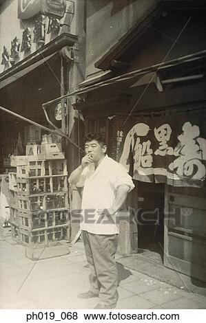 Portrait of an Asian man smoking View Large Photo Image Stock Photo - Portrait of an Asian man smoking. Fotosearch