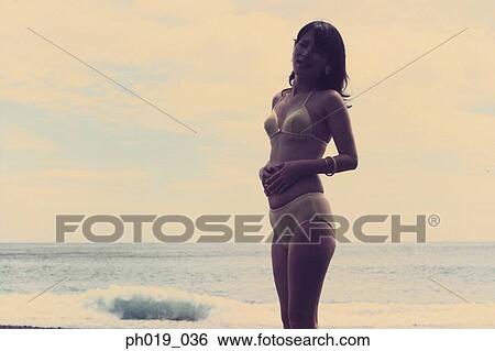 Portrait of an Asian woman in swimwear View Large Photo Image Stock Photograph - Portrait of an Asian woman in swimwear. Fotosearch