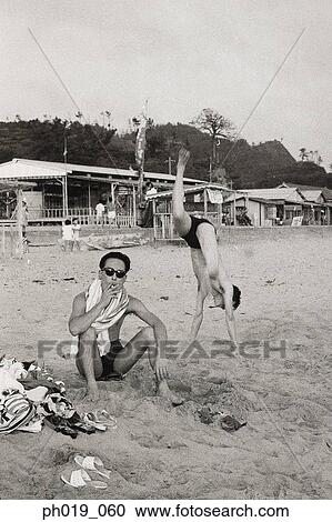 Two men at the beach View Large Photo Image Stock Image - Two men at the beach. Fotosearch