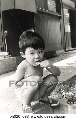 Stock Image - Boy brushing teeth. Fotosearch