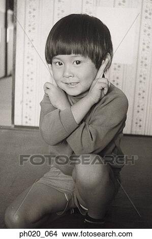 Picture - Boy making money face. Fotosearch
