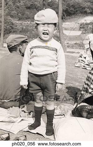 Stock Photograph - Boy making money face. Fotosearch